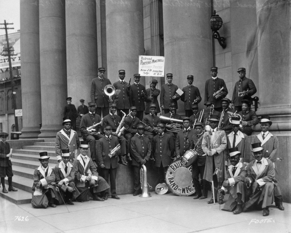 Railway Porters Union Band of Winnipeg posing in front of the Bank of Montreal at the corner of Portage Avenue and Main  Street, May 1, 1922. Photo courtesy of Archives of Manitoba, Foote 291, L.B. Foote Fonds, P7393/4.